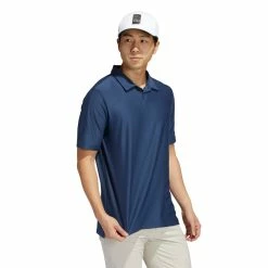 Adidas Go-To Polo Golf Shirt -Golf Clothing Shop GM0039 APP on model walking white 700x700